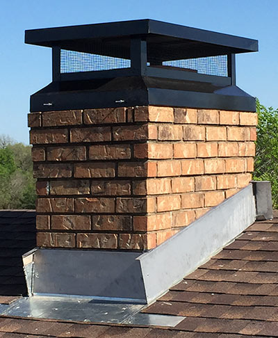 masonry chimney with custom cover