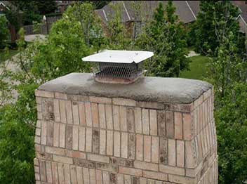 Stock photo of completed chimney repairs-Black Velvet Chimney Beautiful repaired chimney crown and cap sealed with Crown Coat
