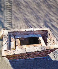 Missing chimney crown and cap on chimney that needs repair