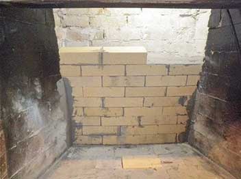 Stock photo of restored firebox-Black Velvet Chimney Fireplace firebox restored with new firebrick on back