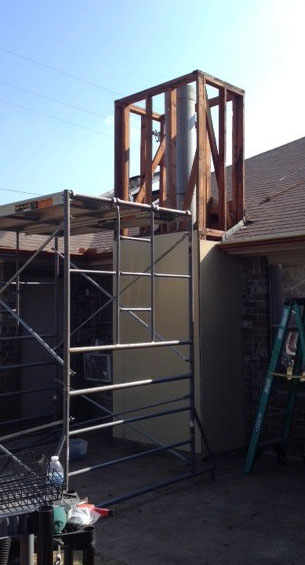 Scaffolding setup and tear out initiating prefab chimney repair