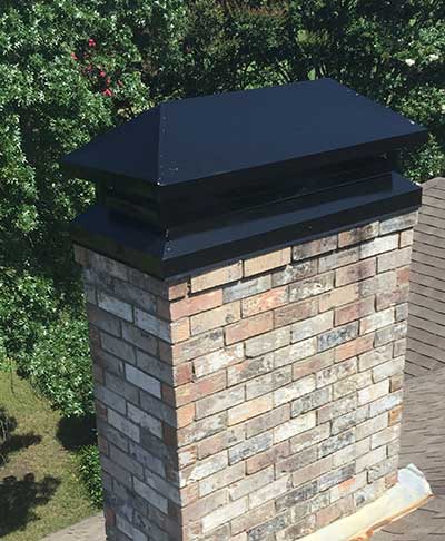 custom chimney metal cover on masonry chimney