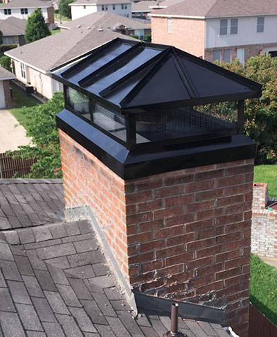 custom chimney metal cover on masonry chimney