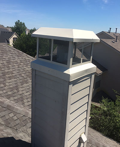 prefab chimney cover on wooden chase