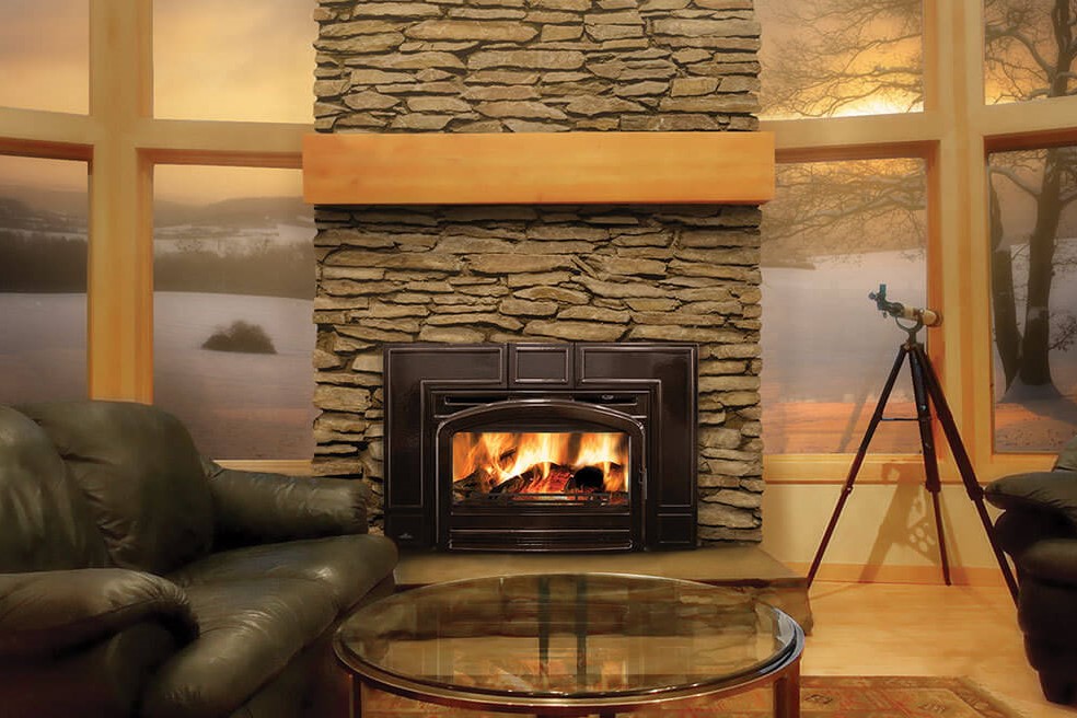 Wood fireplace insert with beautiful stacked stone surround to the ceiling and wood mantel with lots of windows with a telescope