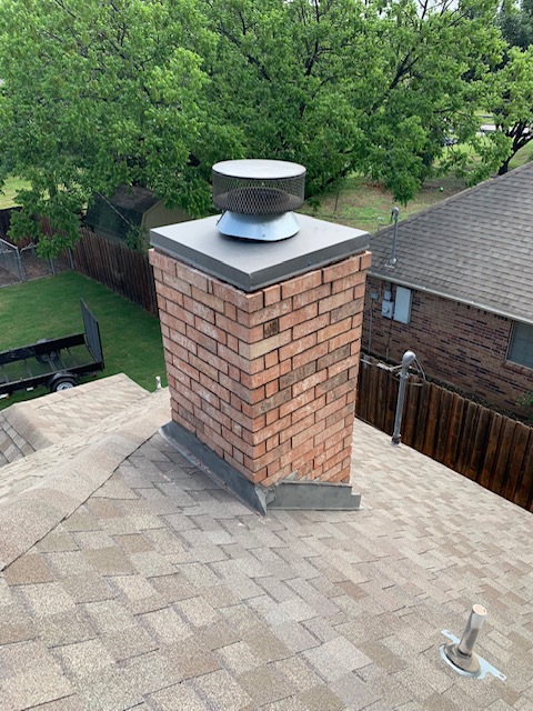 What is the Function of a Chase Cover - Arlington TX - Black Velvet chase cover on brick chimney